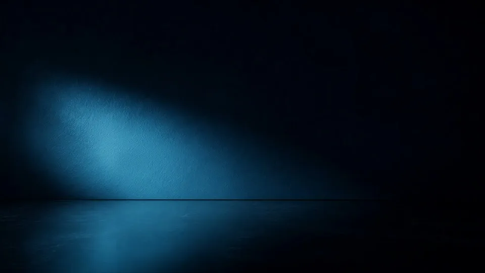 Un campo de luz cian se desliza sobre una pared oscura.