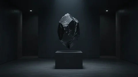 Black-Orbit 2. Un cristal negro flotante gira en una instalacion de luz cinematografica
